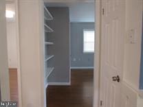 interior space with dark hardwood / wood-style flooring