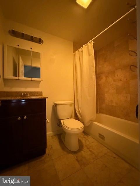 full bathroom with vanity, shower / tub combo with curtain, tile patterned floors, and toilet