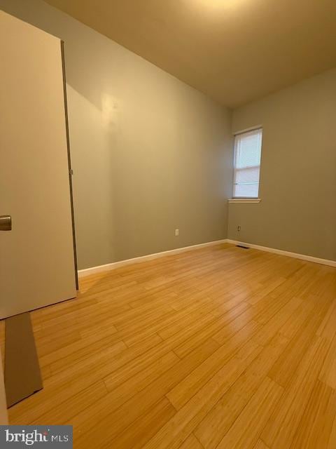 unfurnished room featuring light wood-type flooring