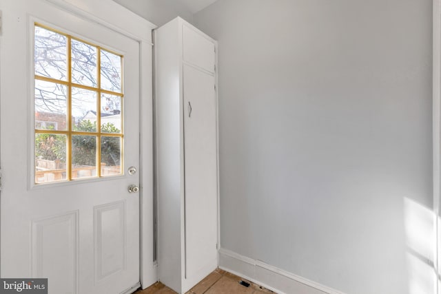 entryway with light tile patterned flooring