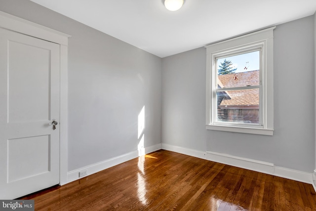 spare room featuring hardwood / wood-style floors