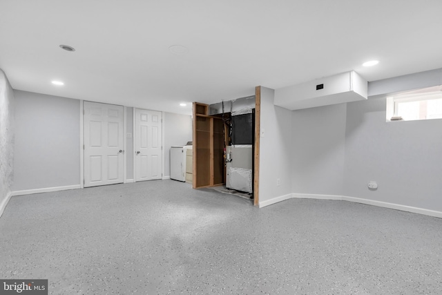 basement with heating unit and washer / dryer