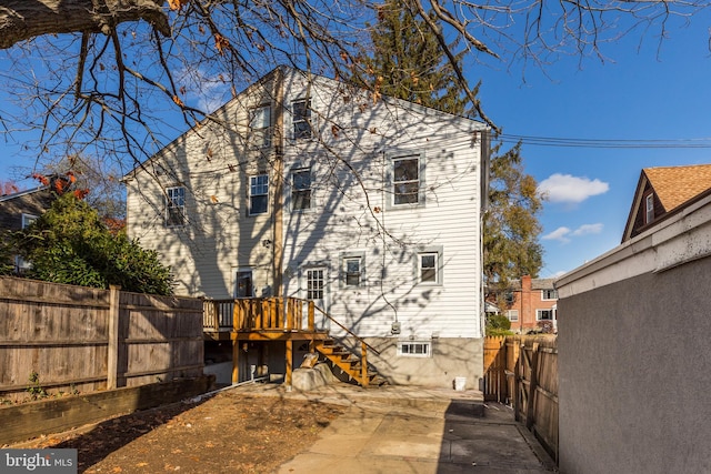 rear view of property with a deck