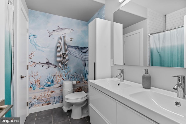 bathroom with vanity, tile patterned floors, and toilet