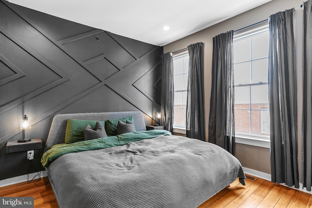 bedroom featuring hardwood / wood-style floors