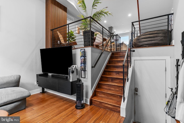 stairs featuring wood-type flooring