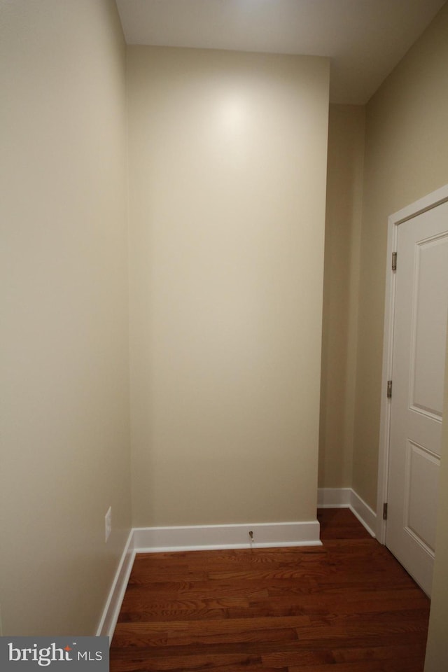 empty room featuring dark wood-type flooring