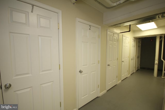 hallway with concrete flooring