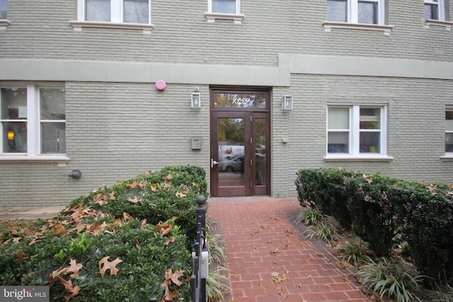 entrance to property featuring a patio