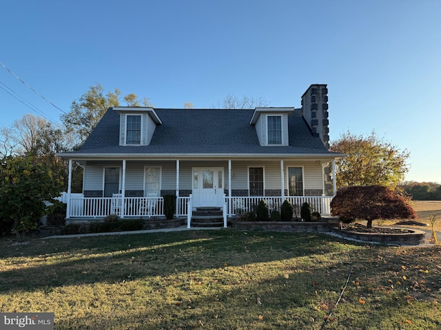 view of front of property with a front lawn and covered porch