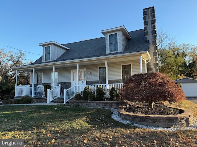 view of front of home featuring a porch and a front lawn