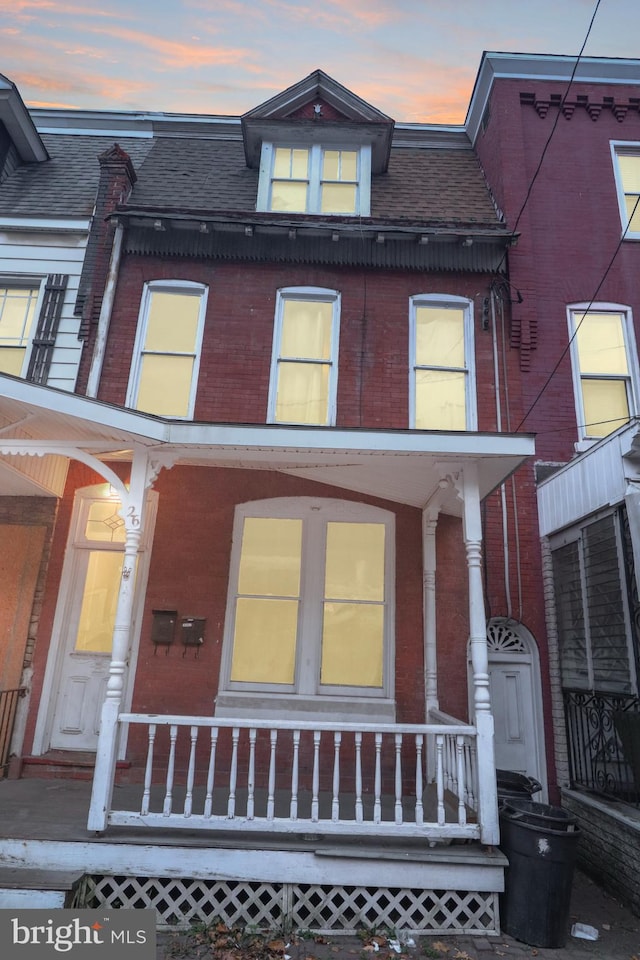 view of property with a porch