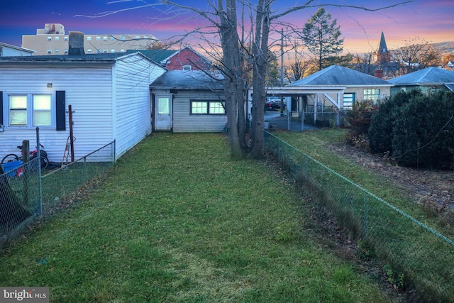 view of yard at dusk