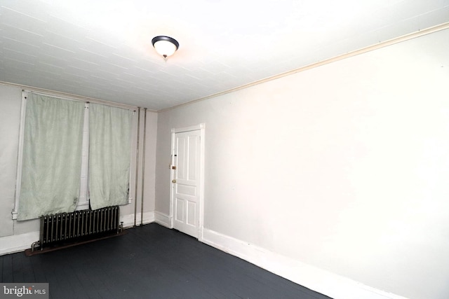 empty room featuring radiator heating unit