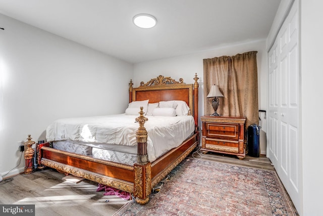 bedroom featuring hardwood / wood-style flooring and a closet