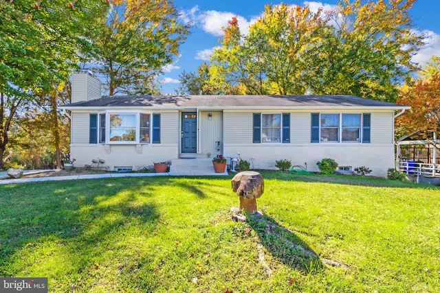 ranch-style house with a front lawn