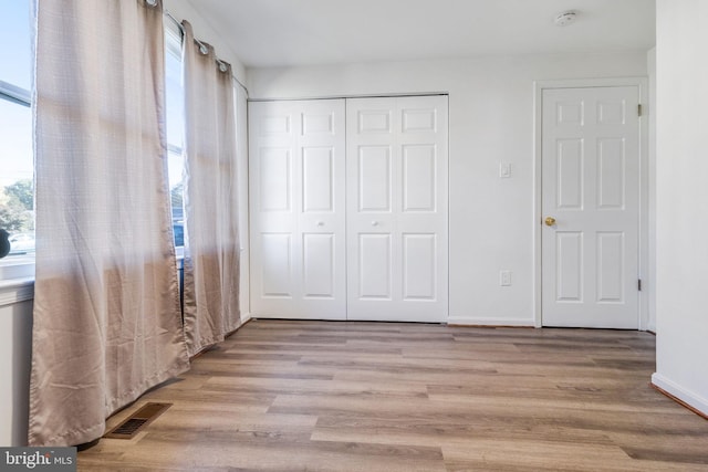 unfurnished bedroom featuring light hardwood / wood-style flooring