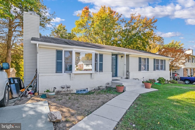 single story home featuring a front yard