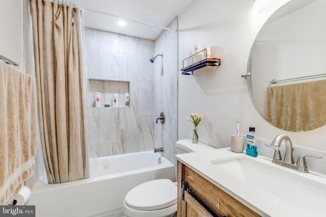 full bathroom featuring toilet, shower / tub combo with curtain, and vanity