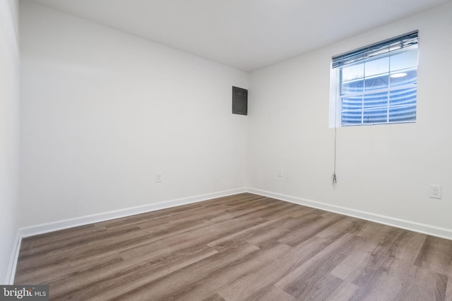 empty room with hardwood / wood-style flooring