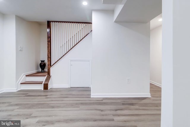 stairway featuring hardwood / wood-style flooring