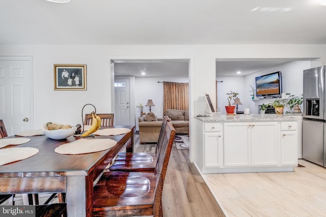 dining space featuring light hardwood / wood-style flooring