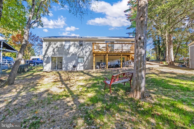 rear view of property featuring a deck