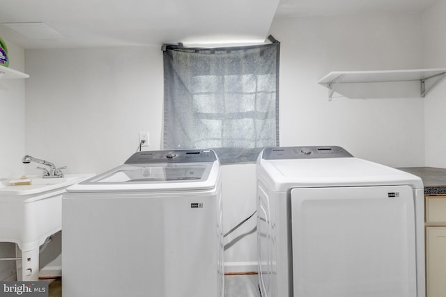 laundry area with washing machine and dryer