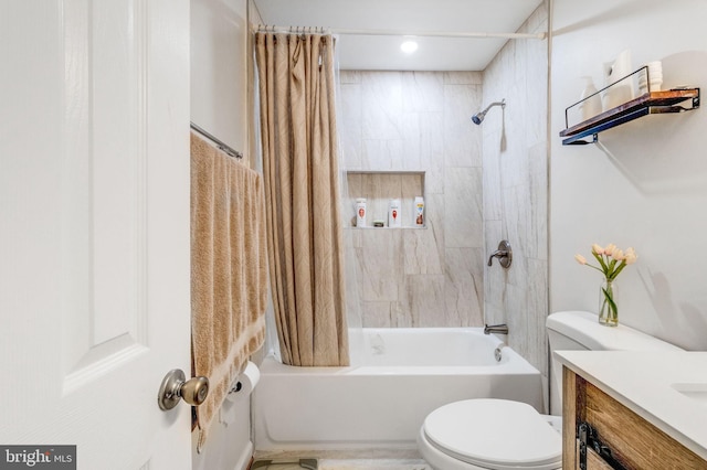 full bathroom featuring shower / tub combo with curtain, vanity, and toilet