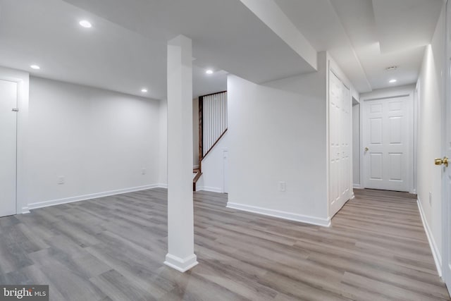 basement featuring light hardwood / wood-style flooring