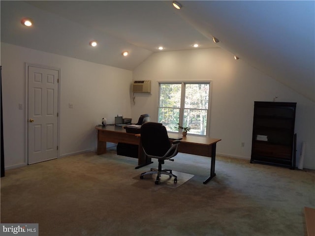 carpeted home office with lofted ceiling