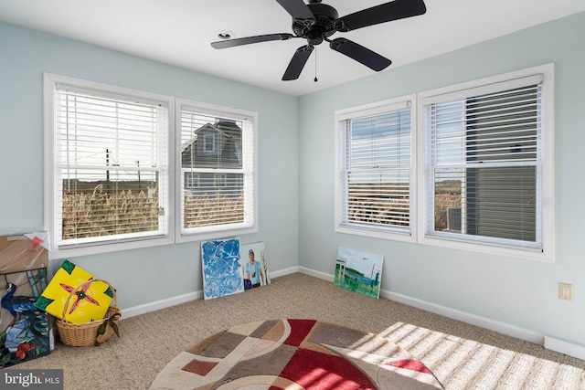 unfurnished bedroom featuring ceiling fan and carpet