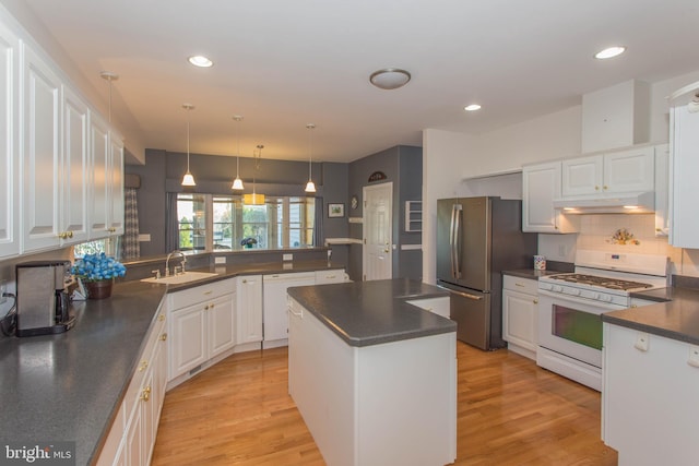 kitchen featuring white cabinetry, kitchen peninsula, light hardwood / wood-style flooring, and white appliances