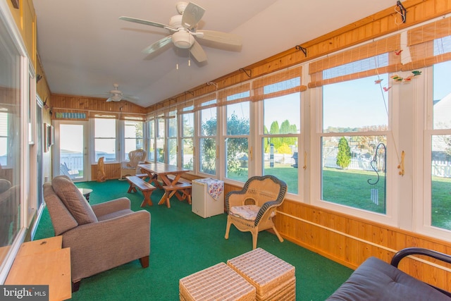 sunroom / solarium featuring a wealth of natural light, lofted ceiling, and ceiling fan