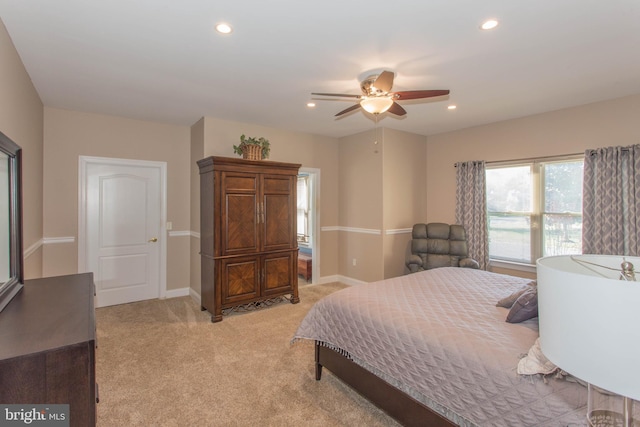 carpeted bedroom with ceiling fan