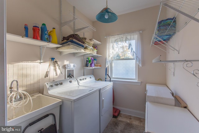 laundry area featuring sink and washer and clothes dryer