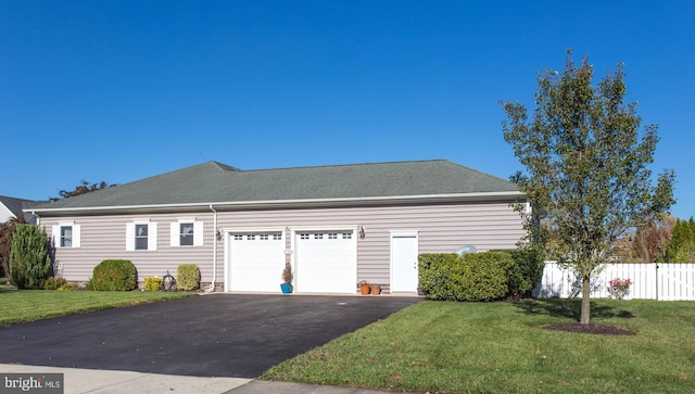 view of home's exterior featuring a lawn and a garage