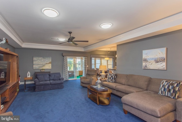 living room with carpet flooring, ceiling fan, and crown molding