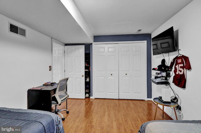 bedroom with wood-type flooring