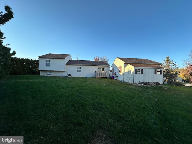 rear view of house with a yard