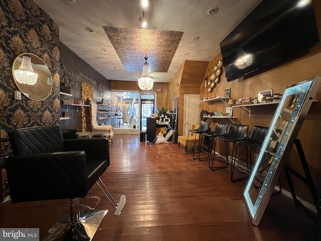 interior space with a notable chandelier and wood-type flooring