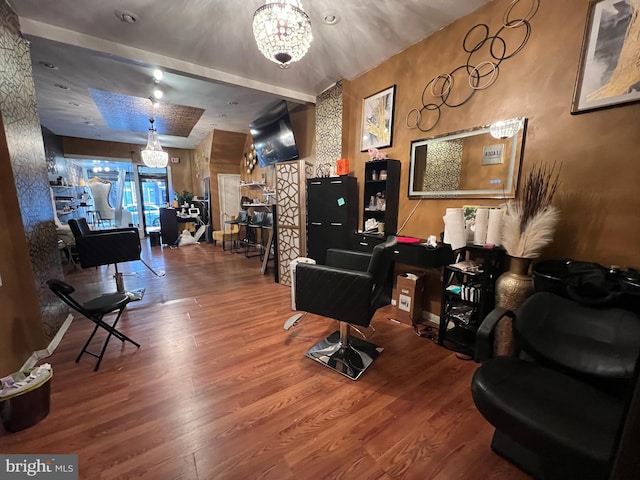 living room with wood-type flooring and a notable chandelier