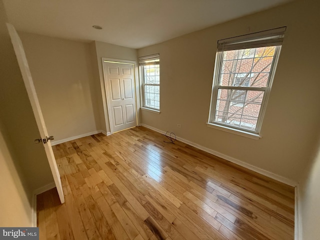 unfurnished bedroom featuring light wood-type flooring