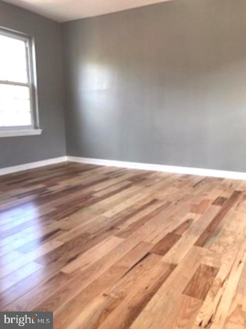 empty room featuring hardwood / wood-style floors