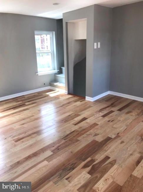 unfurnished room featuring wood-type flooring