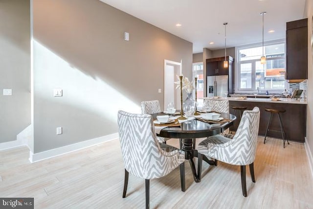 dining room with light hardwood / wood-style floors