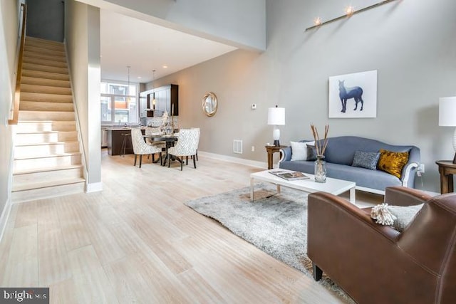 living room with light hardwood / wood-style flooring