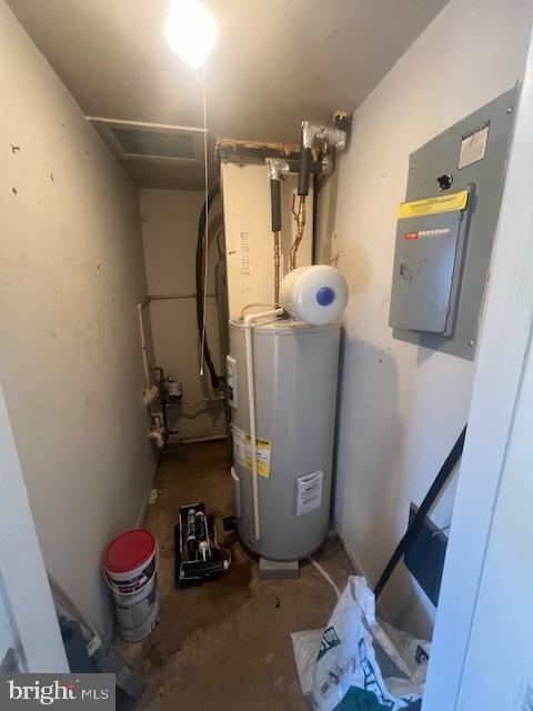 utility room with electric water heater