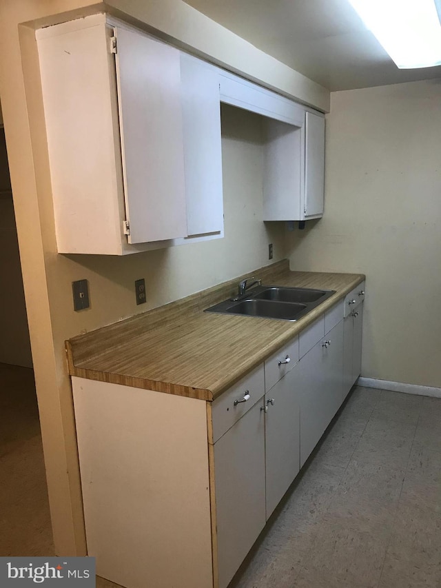 kitchen with white cabinets and sink