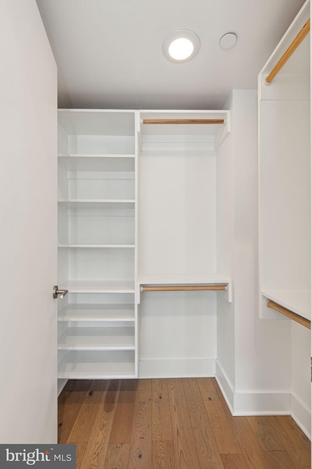 walk in closet featuring hardwood / wood-style floors